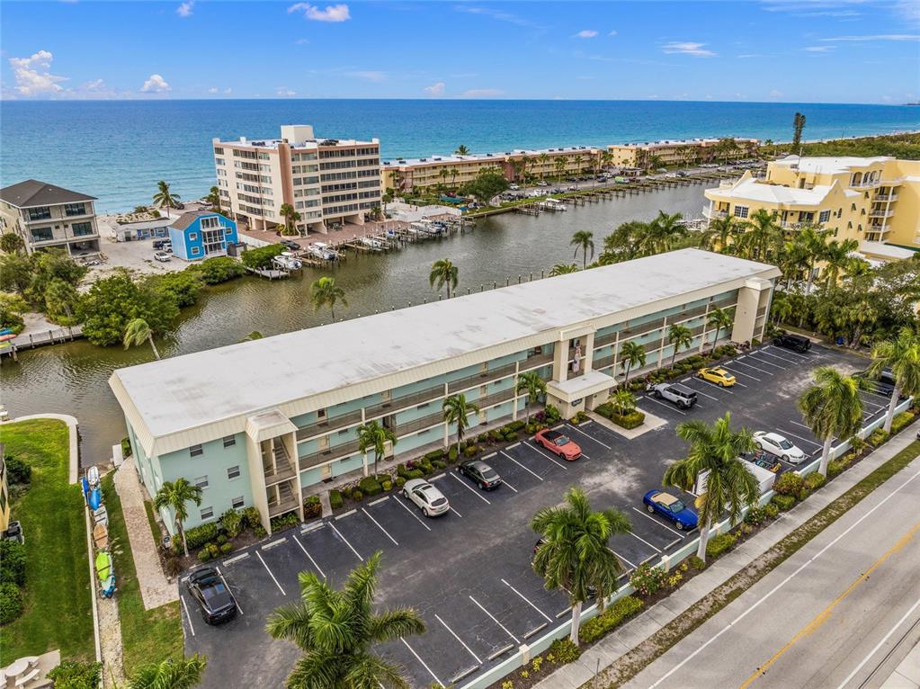 9200 Midnight Pass Road, Unit 17 Sarasota, FL 34242 - Photo 3 of 56 a view of a city with an ocean