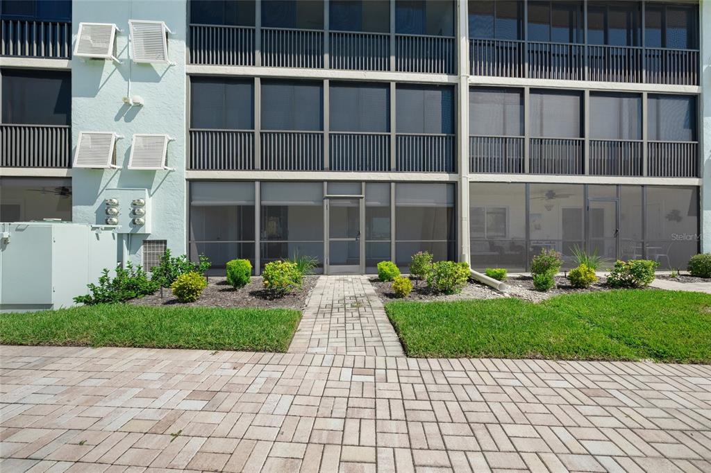 9200 Midnight Pass Road, Unit 17 Sarasota, FL 34242 - Photo 31 of 56 a view of a house with a garden