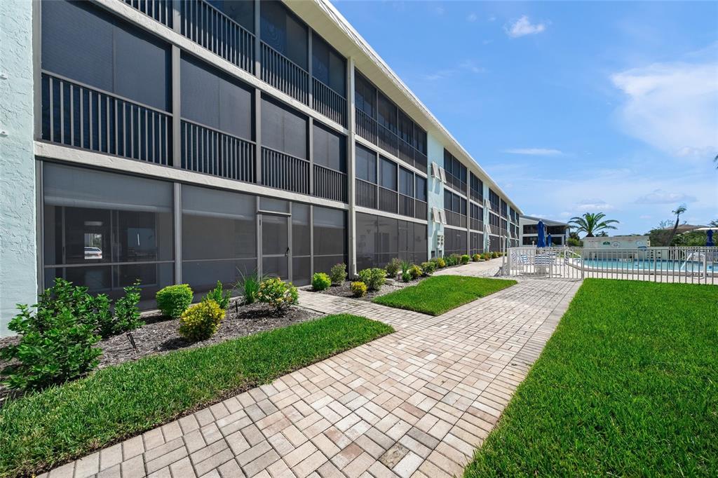 9200 Midnight Pass Road, Unit 17 Sarasota, FL 34242 - Photo 32 of 56 a house view with garden space