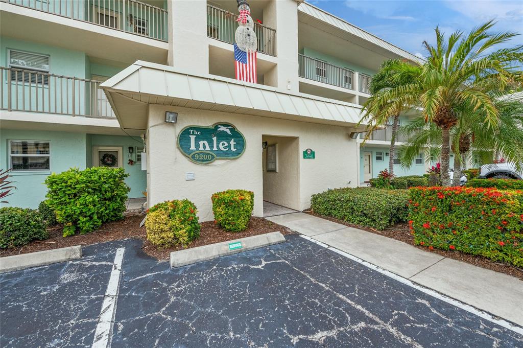 9200 Midnight Pass Road, Unit 17 Sarasota, FL 34242 - Photo 37 of 56 a view of a street with potted plants