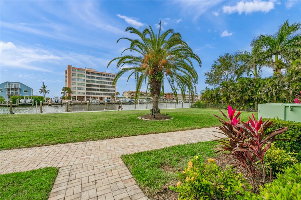 9200 Midnight Pass Road, Unit 17 Sarasota, FL 34242 - Photo 41 of 56 a view of a park with swings and slides