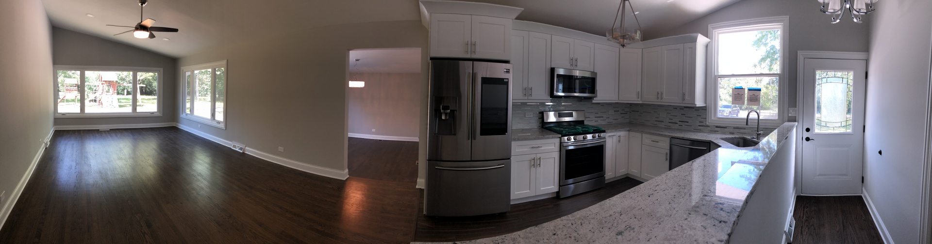 2640 Deerfield Road Riverwoods, IL 60015 - Photo 2 of 15 a kitchen with stainless steel appliances granite countertop a refrigerator a sink a stove and wooden floor