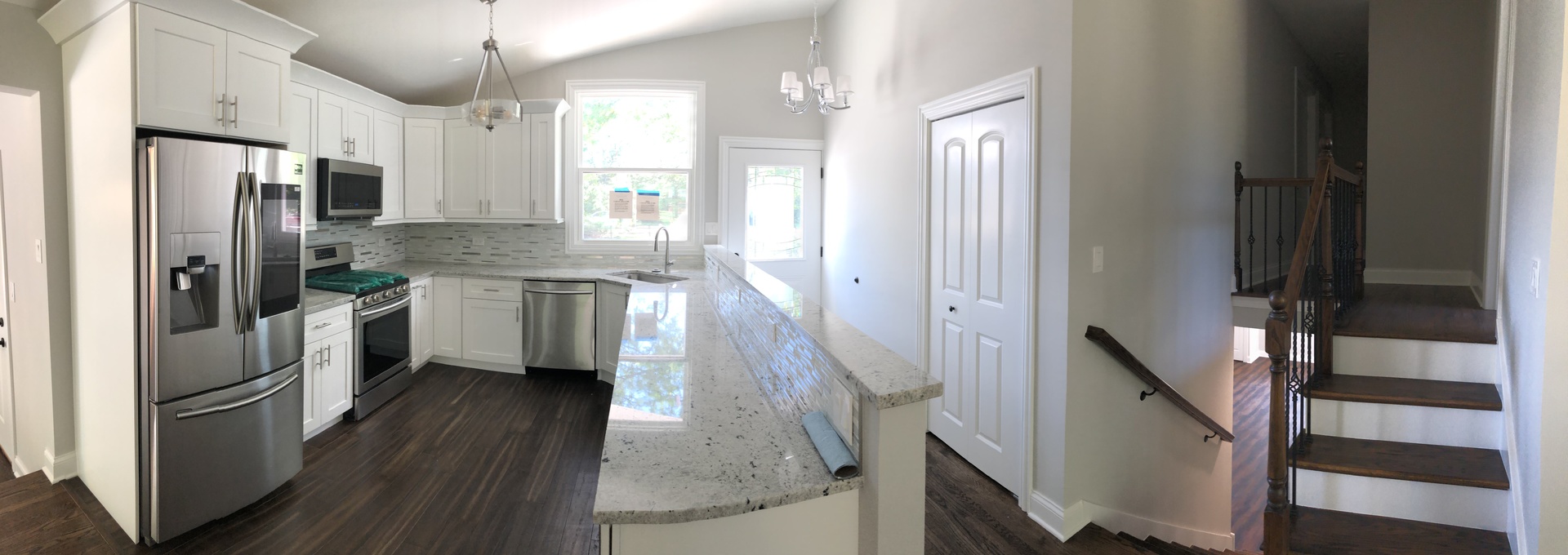 2640 Deerfield Road Riverwoods, IL 60015 - Photo 3 of 15 a kitchen with stainless steel appliances a refrigerator a sink a stove and white cabinets with wooden floor
