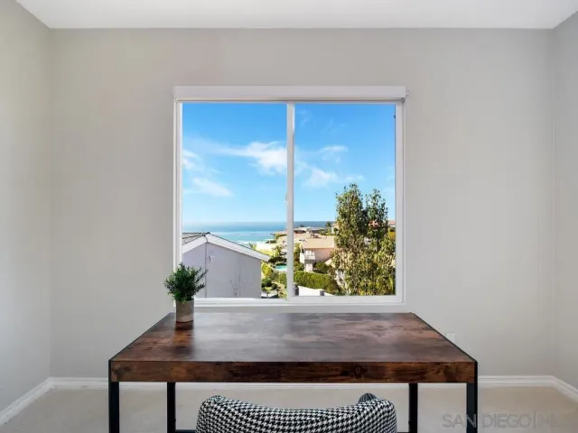 a spacious bathroom with a granite countertop double vanity sink and a mirror
