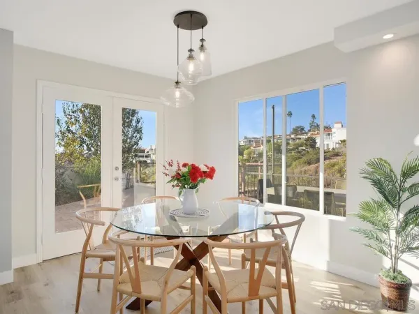 a view of a dining room with furniture window and outside view