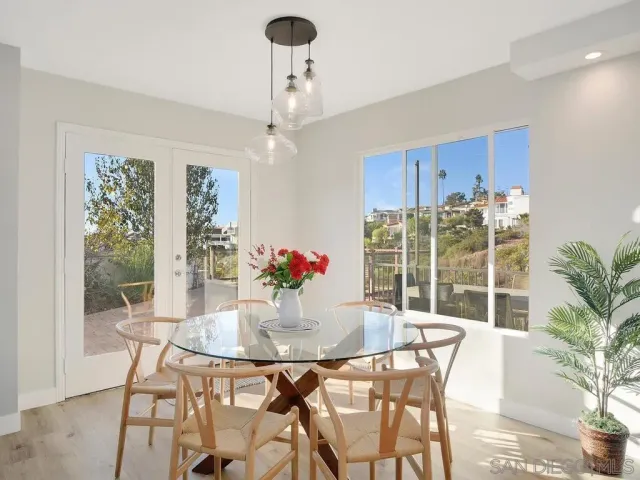 a view of a dining room with furniture window and outside view