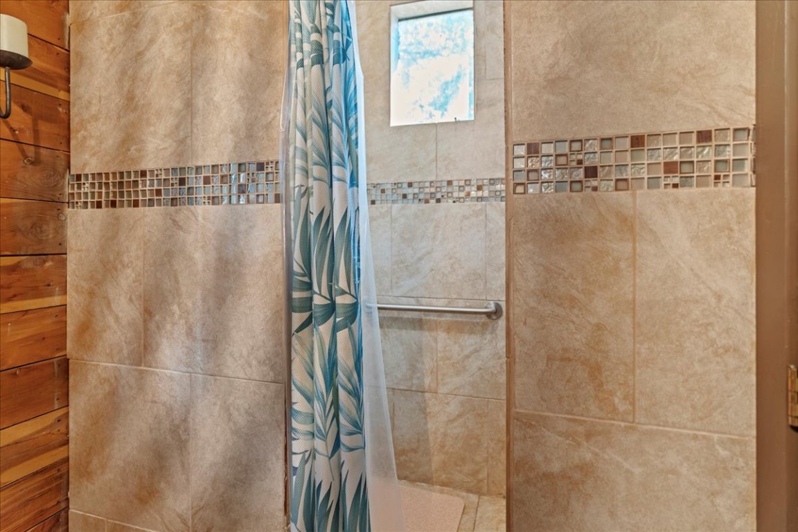 16933 B Ranch Road 12, Unit B Wimberley, TX 78676 - Photo 15 of 19 a bathroom with a shower