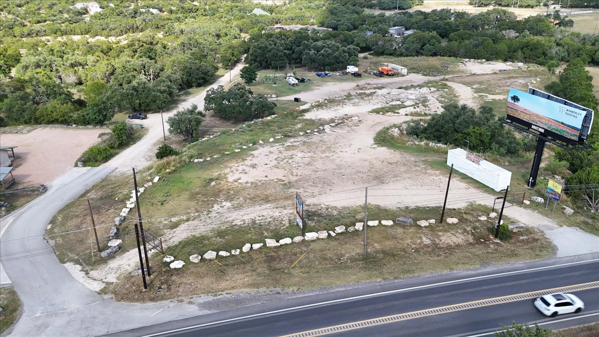 16933 B Ranch Road 12, Unit B Wimberley, TX 78676 - Photo 16 of 19 a view of a yard with table and chairs