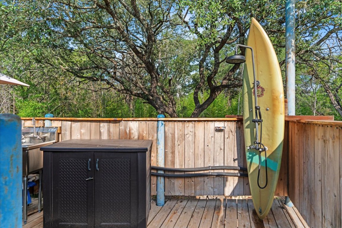 16933 B Ranch Road 12, Unit B Wimberley, TX 78676 - Photo 5 of 19 a view of balcony with wooden floor and fence