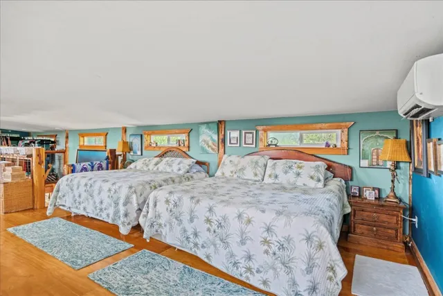 a bedroom with bed and glass door