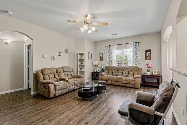 a living room with furniture and a large window