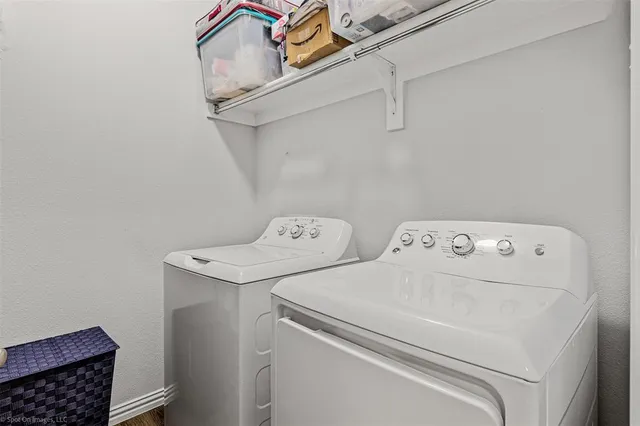 a utility room with dryer and washer