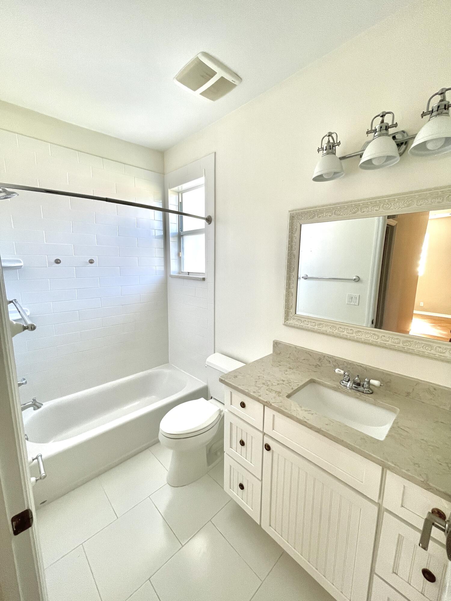 8550 Vía Romana, Unit 2 Boca Raton, FL 33496 - Photo 24 of 28 a bathroom with a sink a toilet and a bathtub