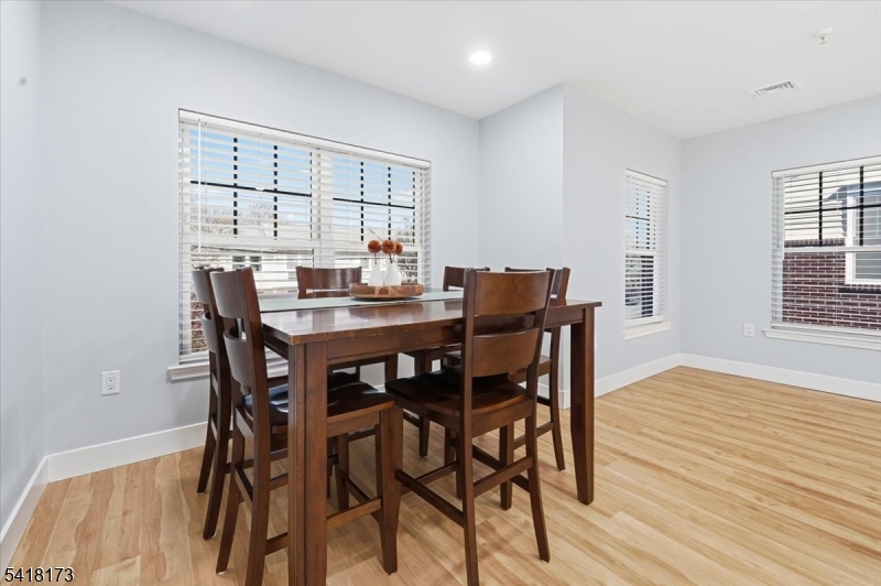 181 Court Street Newark, NJ 07103 - Photo 16 of 38 a view of a dining room with furniture and wooden floor