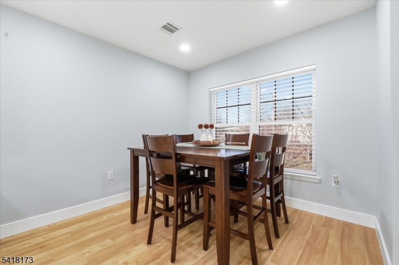 181 Court Street Newark, NJ 07103 - Photo 17 of 38 a view of a dining room with furniture and wooden floor