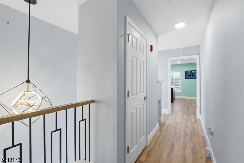 181 Court Street Newark, NJ 07103 - Photo 21 of 38 a view of a hallway with wooden floor