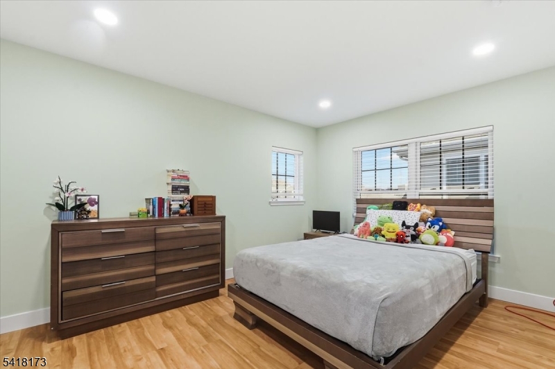 181 Court Street Newark, NJ 07103 - Photo 25 of 38 a bedroom with a bed and window