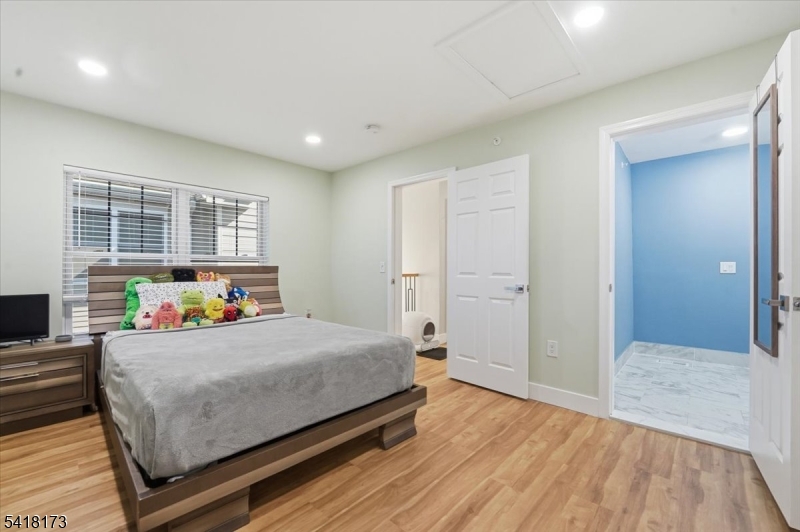 181 Court Street Newark, NJ 07103 - Photo 28 of 38 a bedroom with a bed and a window