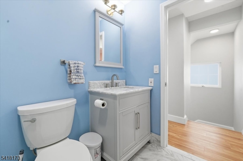 181 Court Street Newark, NJ 07103 - Photo 30 of 38 a white toilet sitting next to a bathroom sink