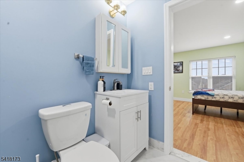 181 Court Street Newark, NJ 07103 - Photo 33 of 38 a white toilet sitting next to a bathroom sink