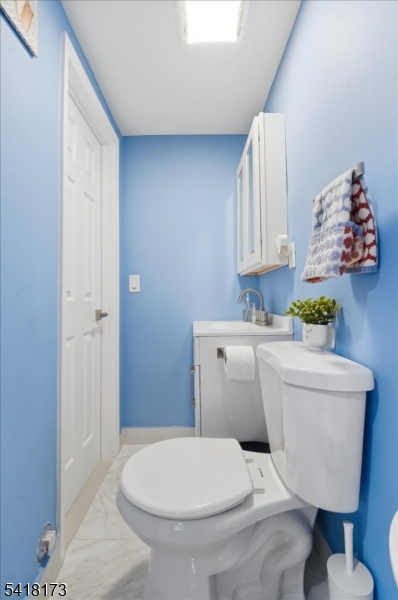 181 Court Street Newark, NJ 07103 - Photo 8 of 38 a bathroom with a toilet and a sink