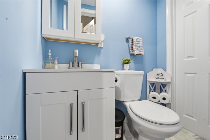 181 Court Street Newark, NJ 07103 - Photo 9 of 38 a white toilet sitting next to a bathroom sink