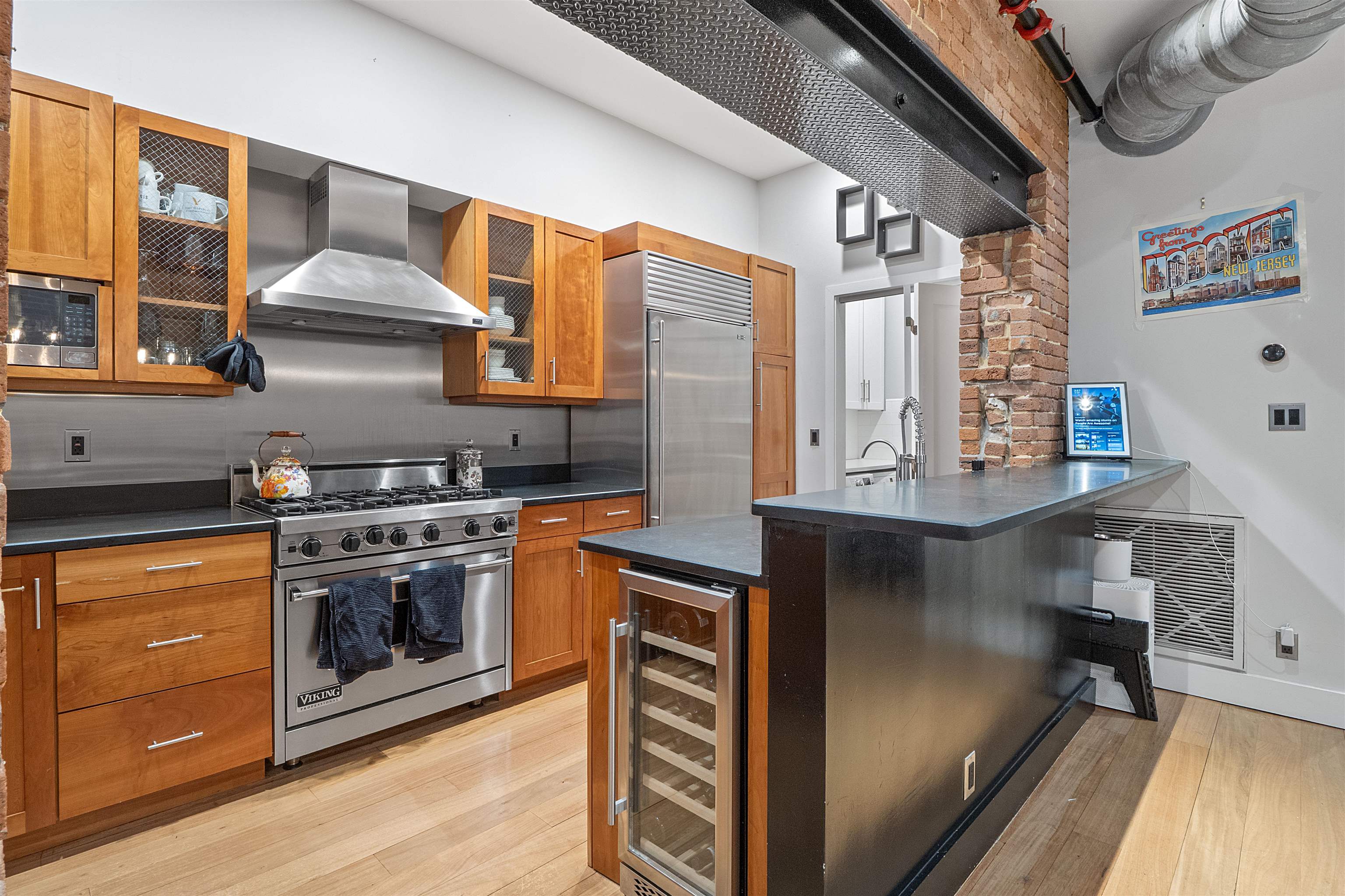 610 Clinton Street, Unit 2A Hoboken, NJ 07030 - Photo 12 of 33 a kitchen with stainless steel appliances granite countertop a stove and a sink