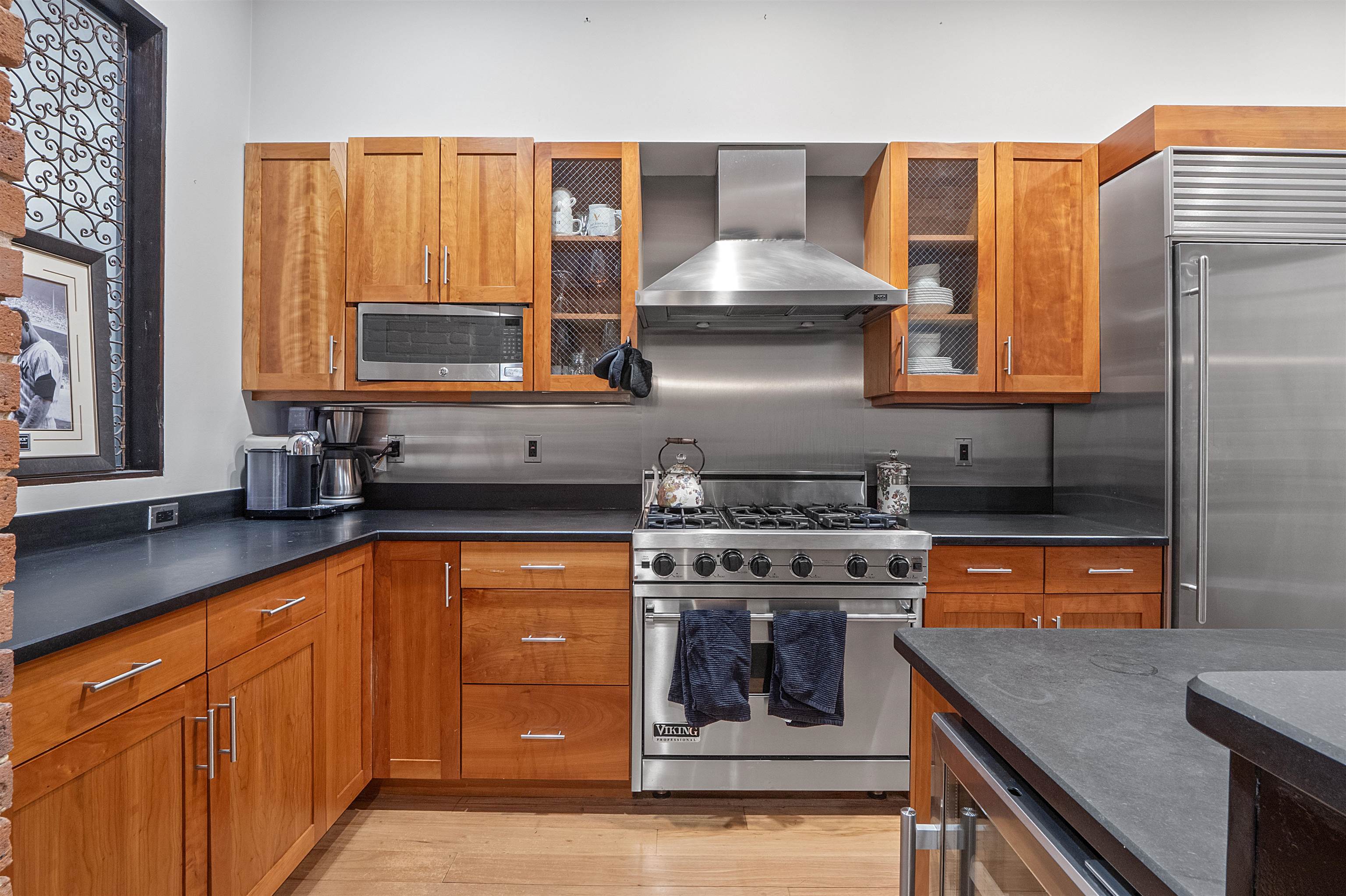 610 Clinton Street, Unit 2A Hoboken, NJ 07030 - Photo 13 of 33 a kitchen with stainless steel appliances granite countertop a stove and a microwave