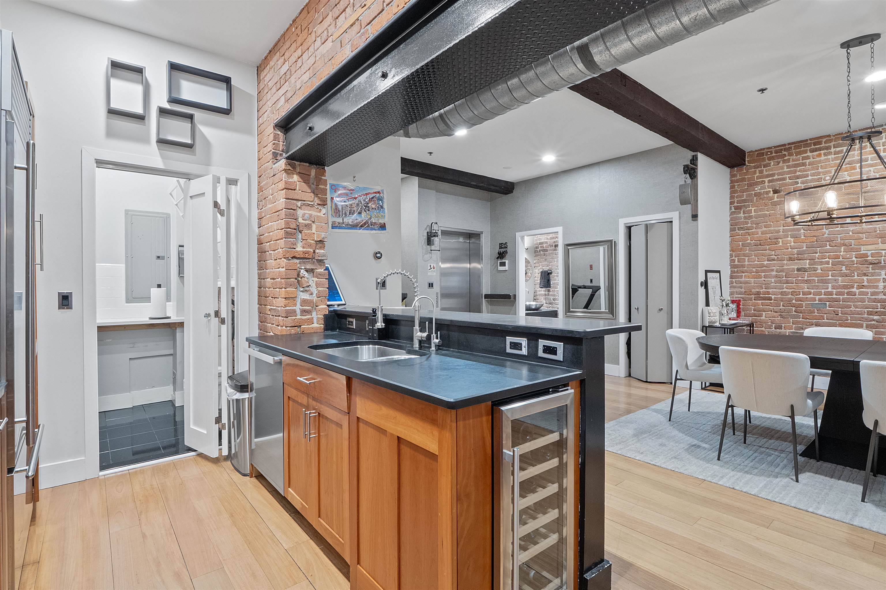 610 Clinton Street, Unit 2A Hoboken, NJ 07030 - Photo 14 of 33 a kitchen with stainless steel appliances granite countertop a sink a stove and refrigerator