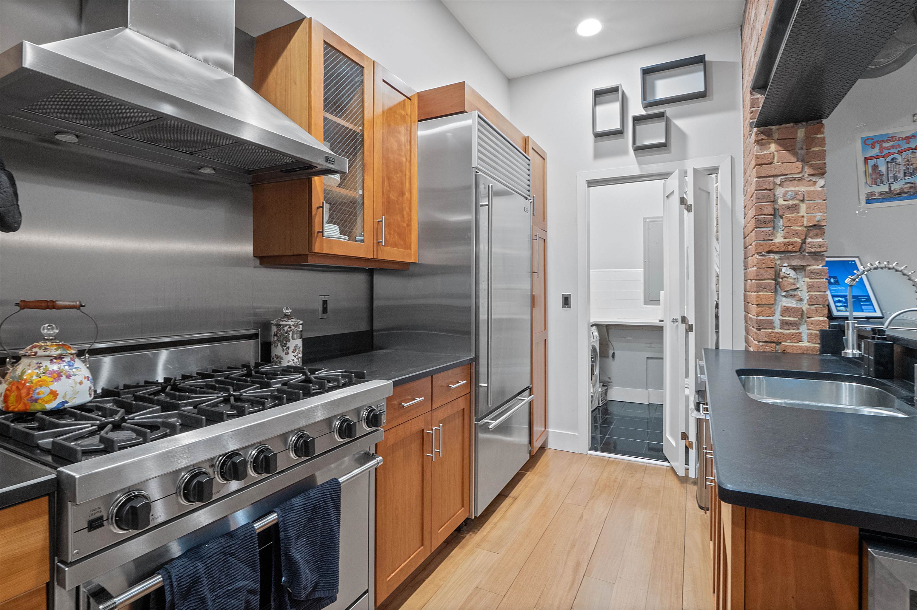 610 Clinton Street, Unit 2A Hoboken, NJ 07030 - Photo 15 of 33 a kitchen with stainless steel appliances granite countertop a stove and a refrigerator