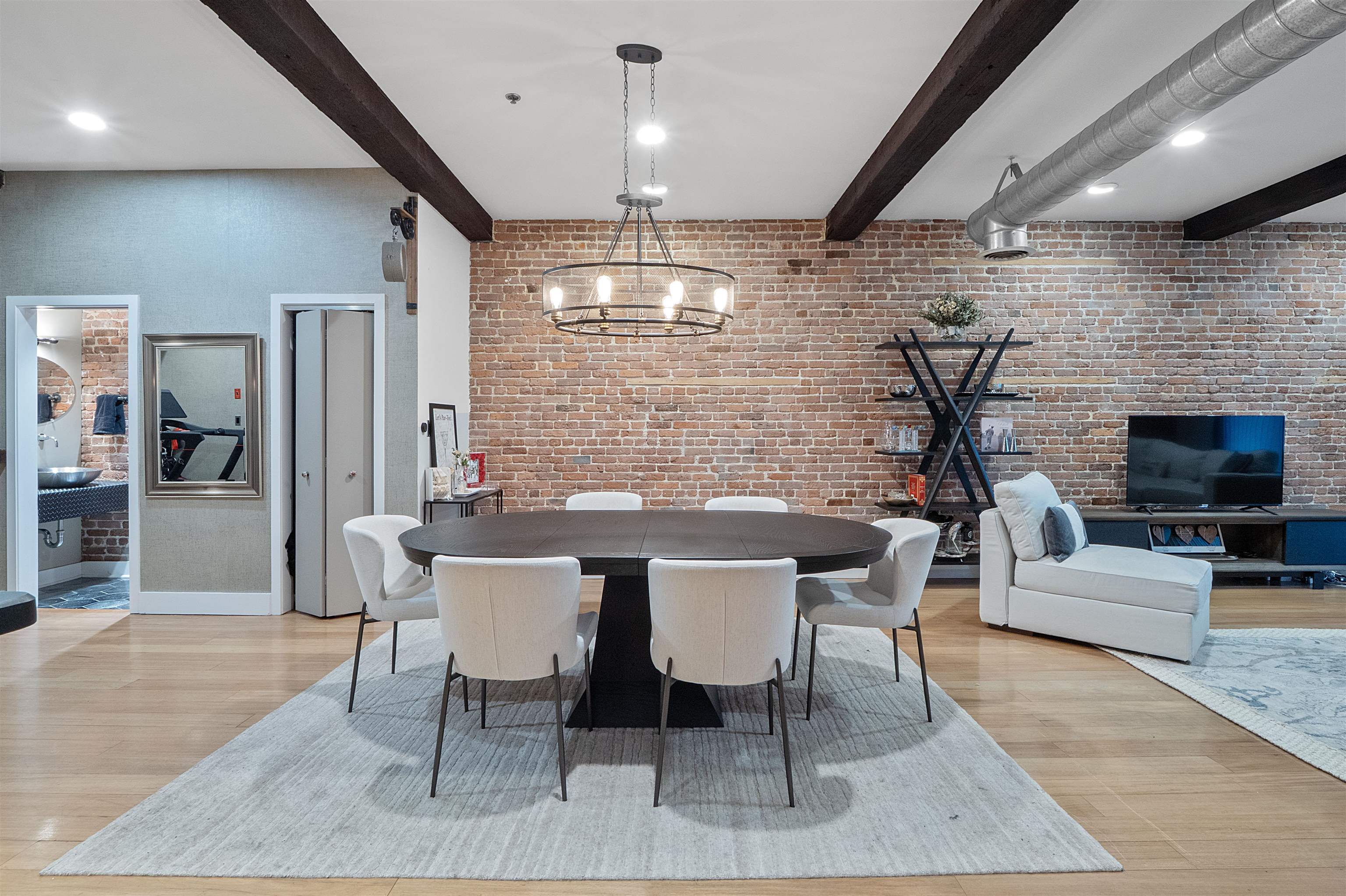 610 Clinton Street, Unit 2A Hoboken, NJ 07030 - Photo 18 of 33 a dining room with furniture a chandelier and wooden floor