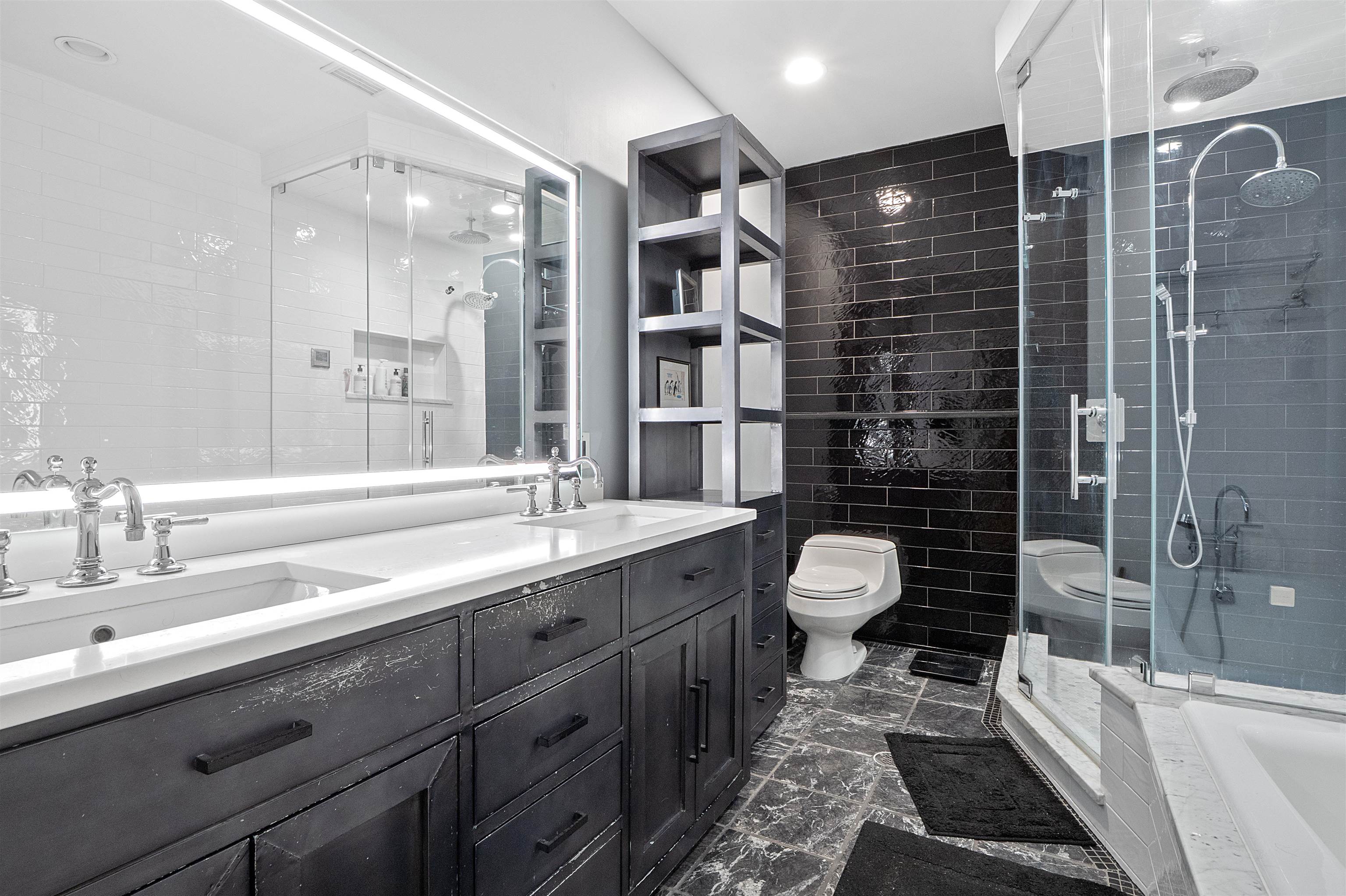 610 Clinton Street, Unit 2A Hoboken, NJ 07030 - Photo 29 of 33 a bathroom with a double vanity sink toilet and shower