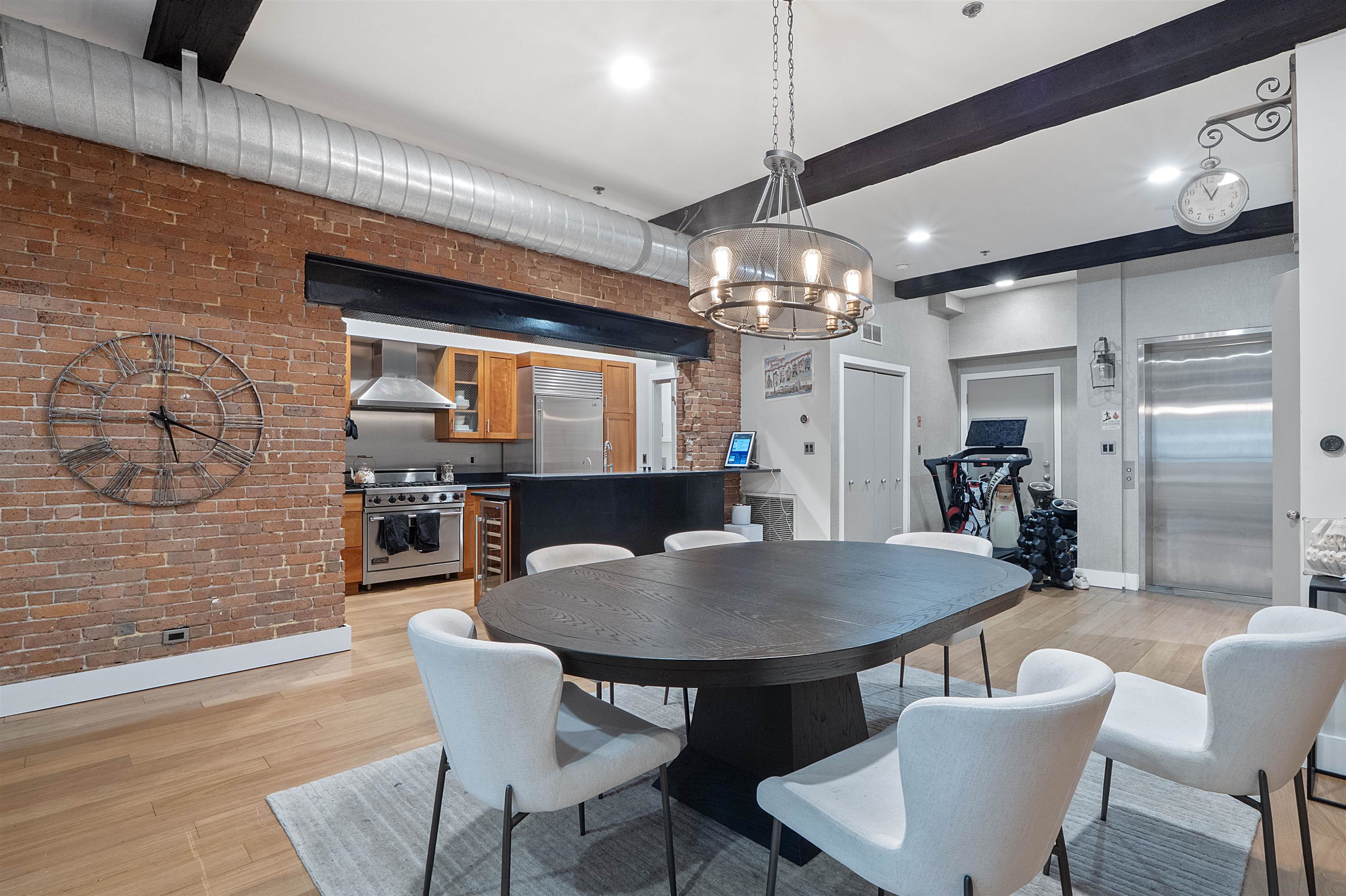 610 Clinton Street, Unit 2A Hoboken, NJ 07030 - Photo 9 of 33 a view of a dining room with furniture and chandelier