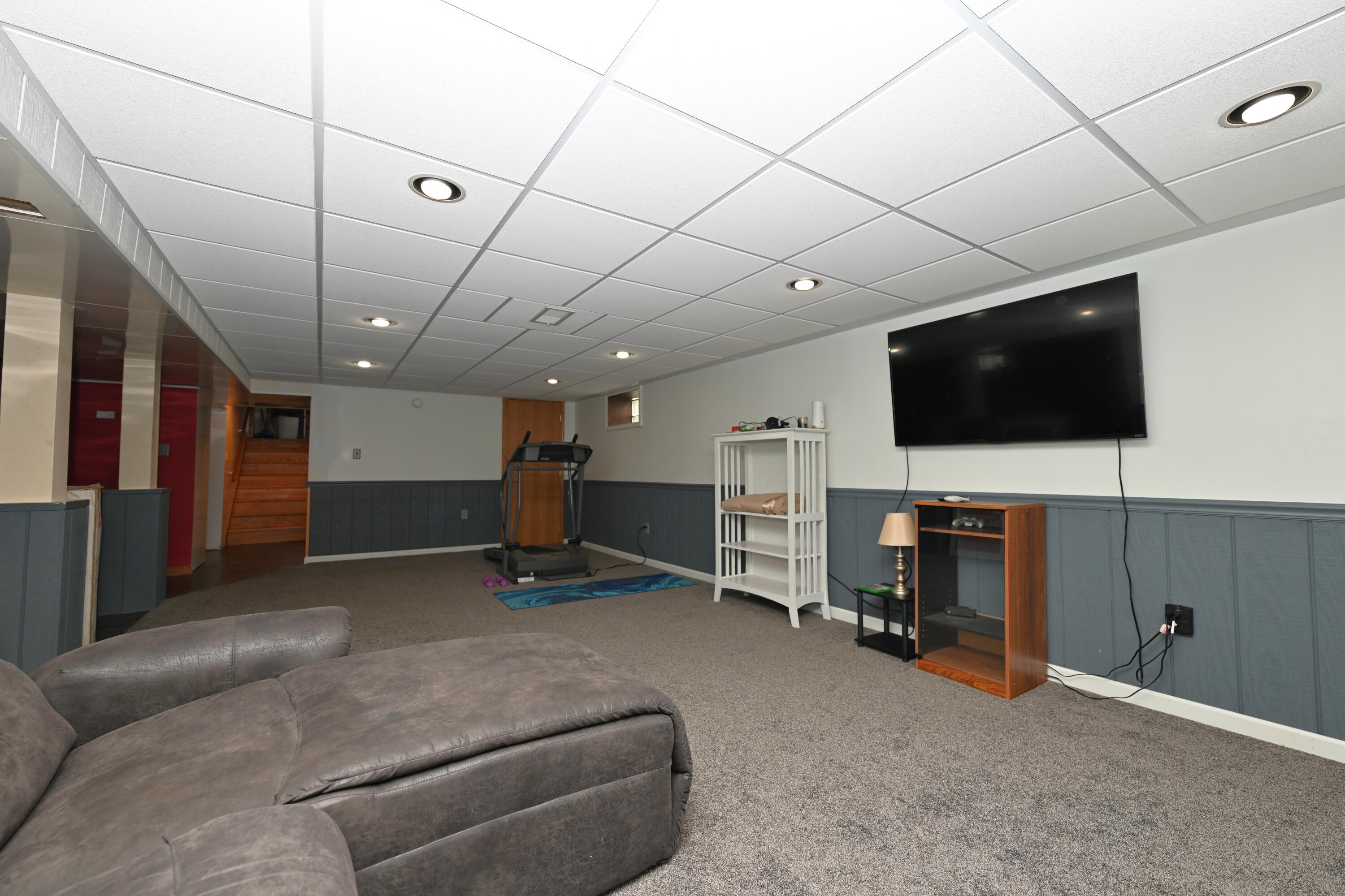 5110 West 400 North Winamac, IN 46996 - Photo 32 of 35 a living room with furniture and a flat screen tv