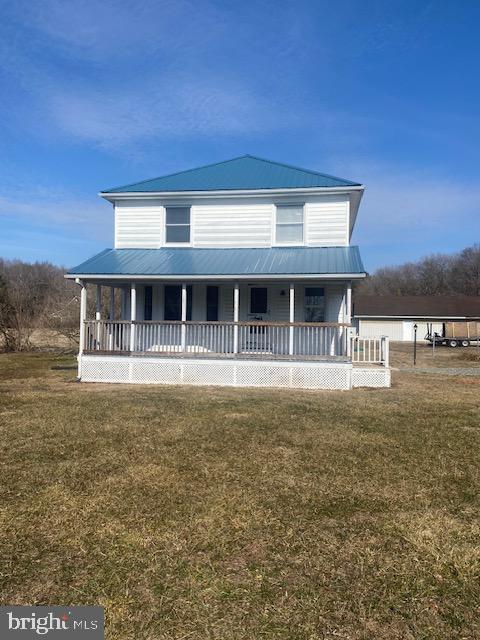 20773 Atlanta Road, Unit 87 Seaford, DE 19973 - Photo 1 of 20 a front view of a house with a garden