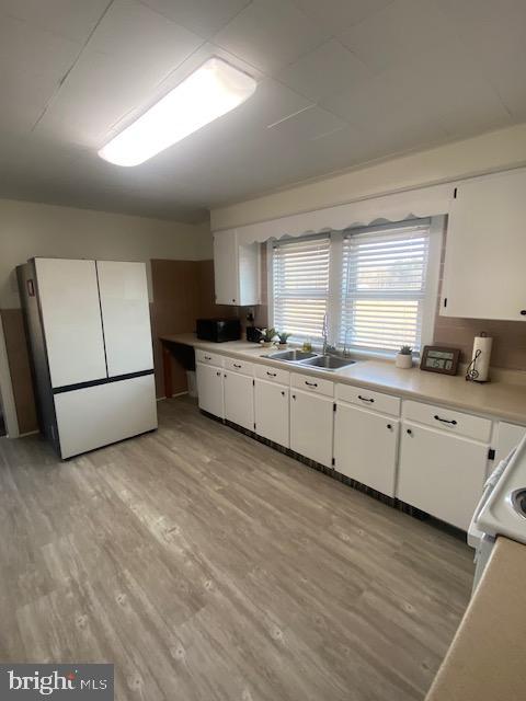 20773 Atlanta Road, Unit 87 Seaford, DE 19973 - Photo 11 of 20 a kitchen with stainless steel appliances granite countertop a stove a sink and a refrigerator