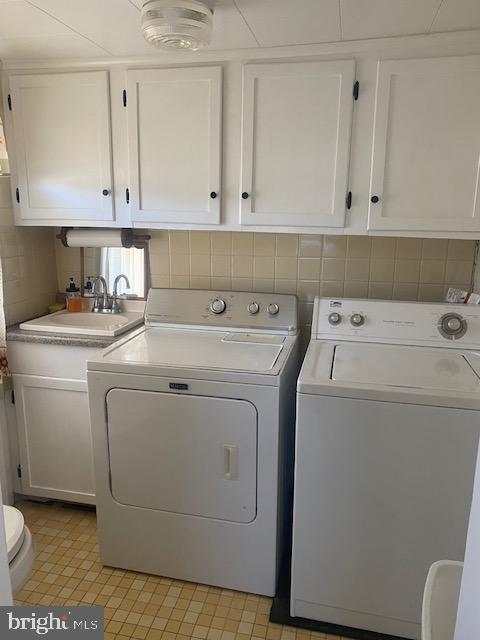 20773 Atlanta Road, Unit 87 Seaford, DE 19973 - Photo 20 of 20 a utility room with dryer and washer