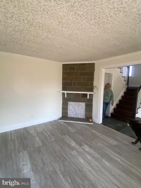 20773 Atlanta Road, Unit 87 Seaford, DE 19973 - Photo 8 of 20 a view of an empty room with wooden floor fireplace and a window