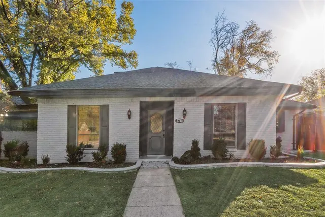 a view of a house with swimming pool and sitting area