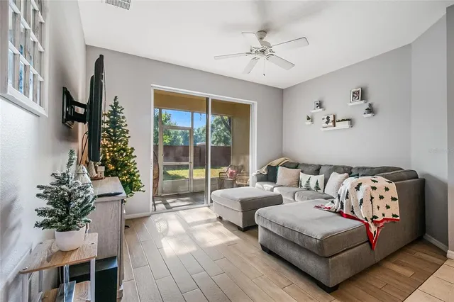 a living room with furniture and a large window