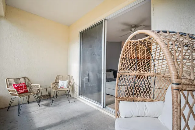 a living room with a large window and outer view