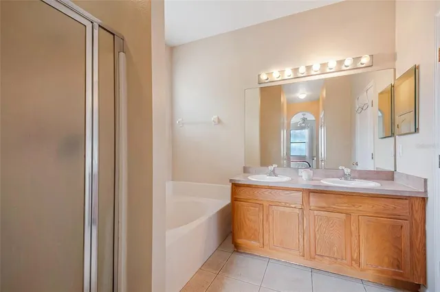 a bedroom with a bed and with furniture