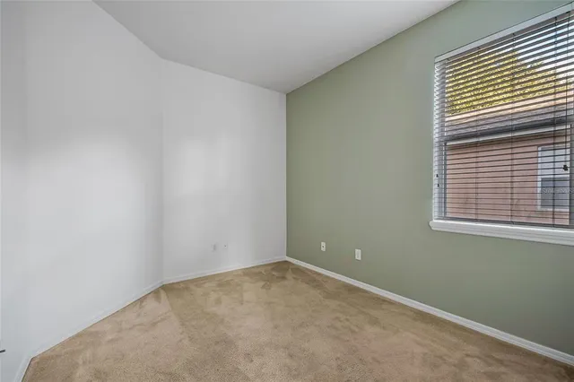 a en suite bathroom with a toilet sink and mirror