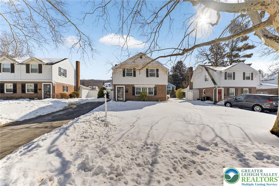 926 Buttonwood Street Emmaus, PA 18049 - Photo 1 of 63 a view of residential houses with snow on the road