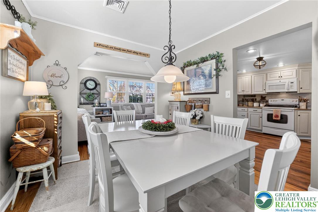 926 Buttonwood Street Emmaus, PA 18049 - Photo 11 of 63 a view of a dining room with furniture and a chandelier
