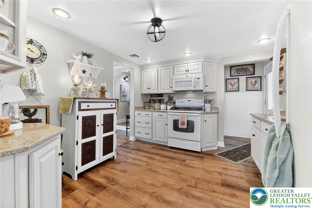 926 Buttonwood Street Emmaus, PA 18049 - Photo 13 of 63 a kitchen with stainless steel appliances granite countertop a stove and a sink