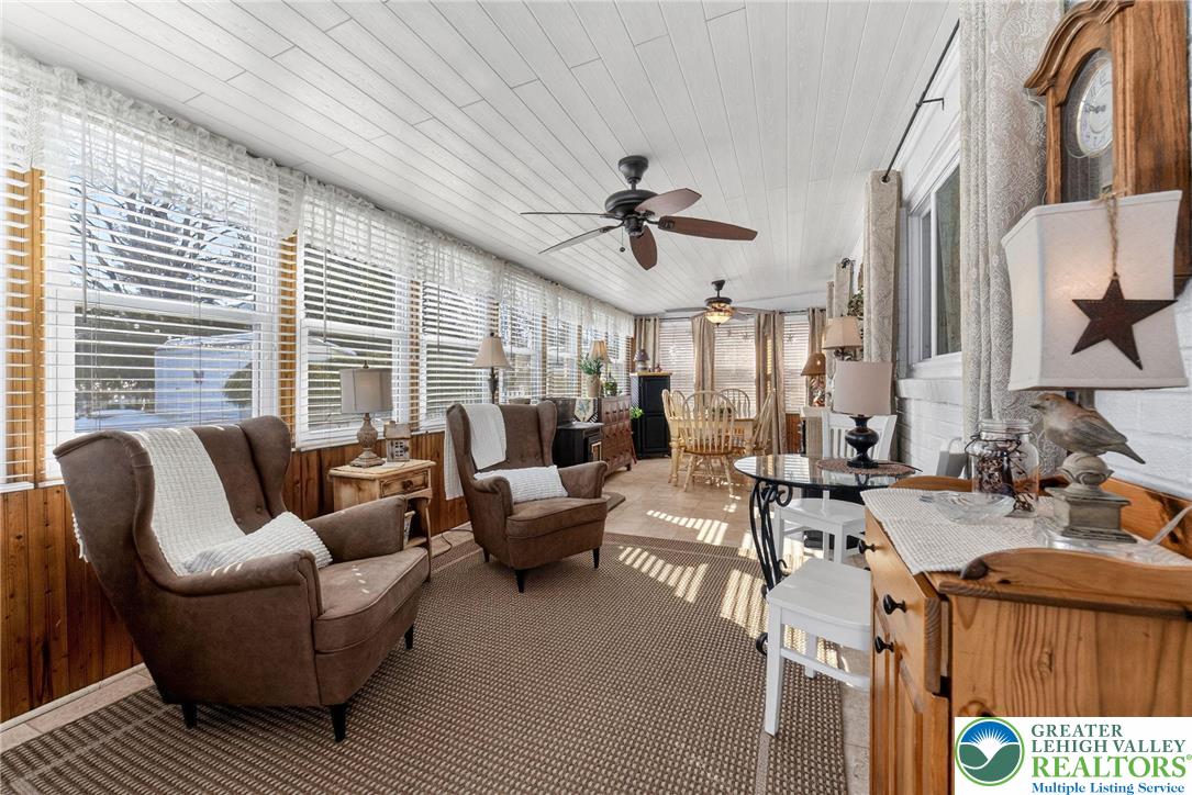 926 Buttonwood Street Emmaus, PA 18049 - Photo 17 of 63 a living room with furniture ceiling fan and a window