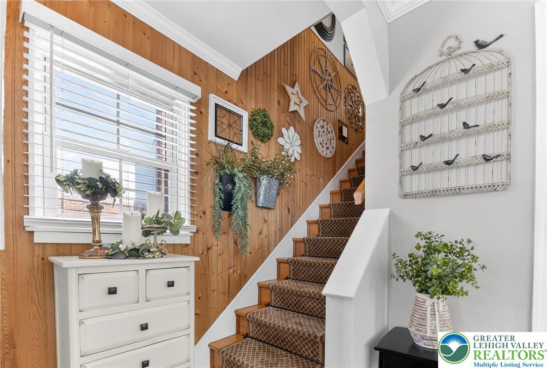 926 Buttonwood Street Emmaus, PA 18049 - Photo 8 of 63 a view of staircase with wooden floor and a potted plant