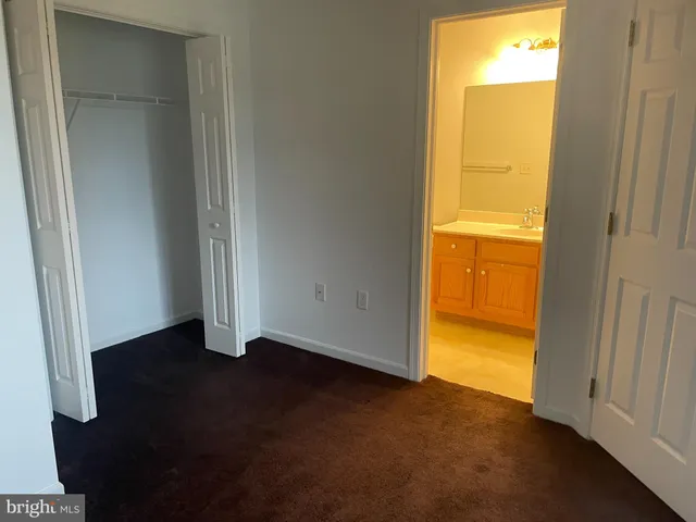 a view of an empty room and a window