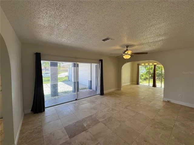 a view of a hallway with a chandelier